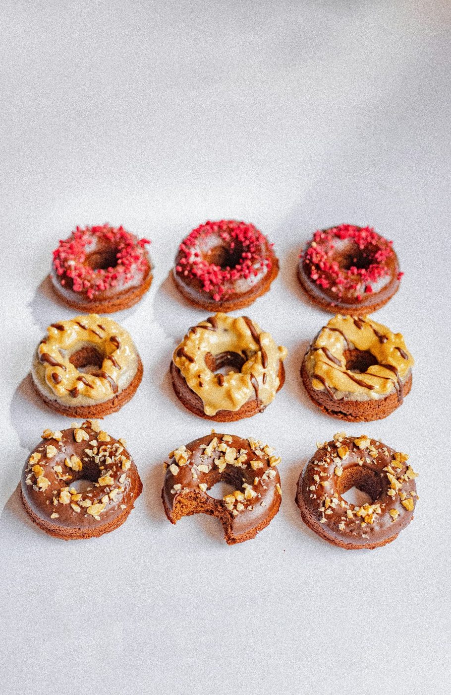 Glazed doughnuts arranged in rows
