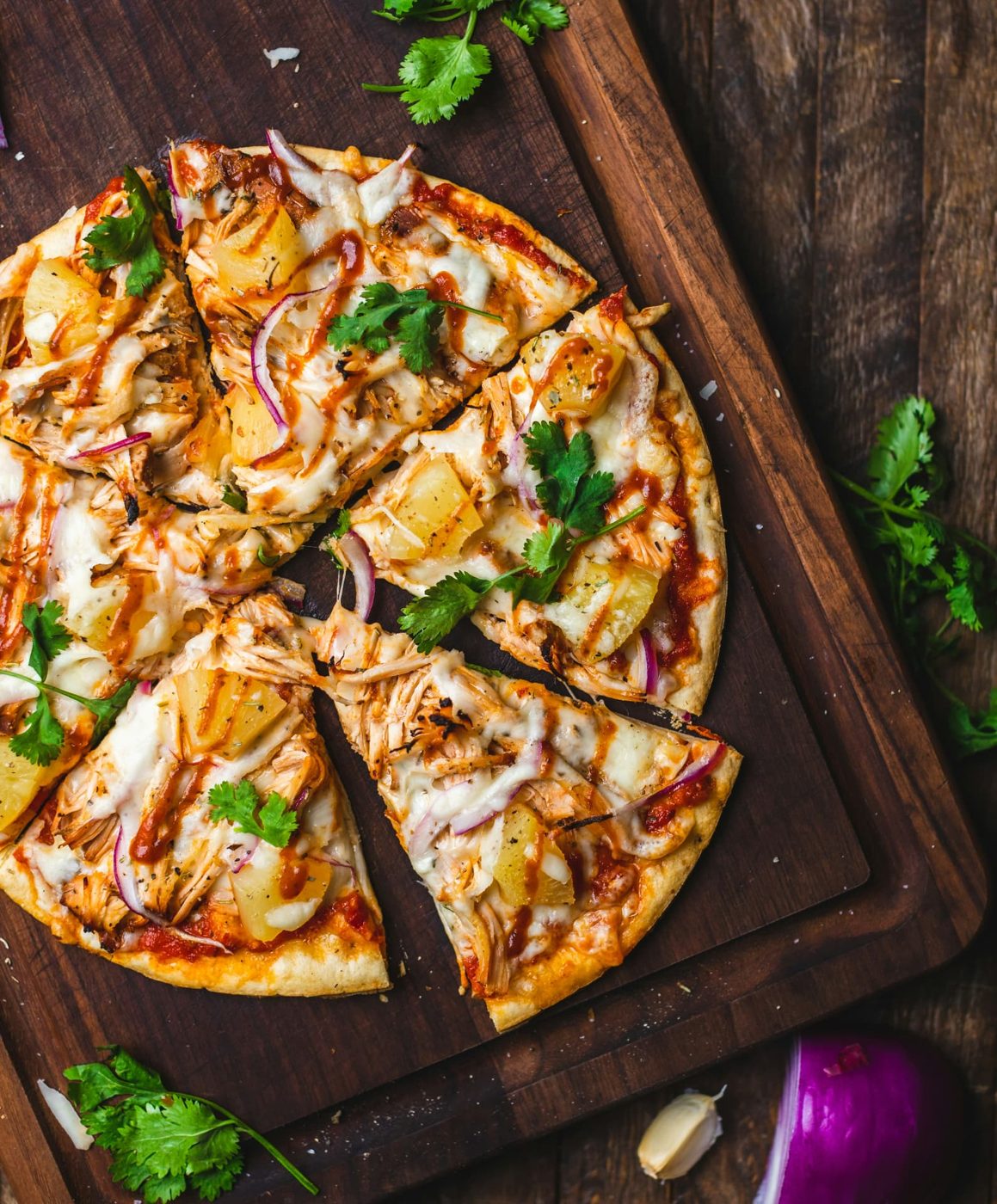 Freshly baked pizza on a wooden board